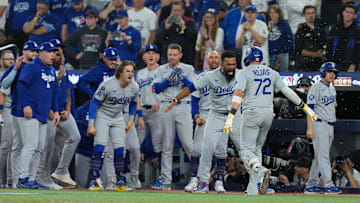 Dodgers second baseman Miguel Rojas reacts after hitting a game-tying home run in the ninth inning of Game 7 in the 2025 World Series.