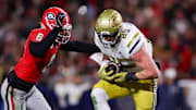 Nov 29, 2024; Athens, Georgia, USA; Georgia Tech Yellow Jackets tight end Jackson Hawes (85) catches a pass over Georgia Bulldogs defensive back Daylen Everette (6) in the second quarter