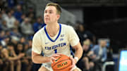 Feb 8, 2025; Omaha, Nebraska, USA;  Creighton Bluejays guard Steven Ashworth (1) attempts a shot against the Marquette Golden Eagles in the second half at CHI Health Center Omaha. Mandatory Credit: Steven Branscombe-Imagn Images