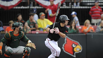 Jun 1, 2013; Louisville, KY, USA; Louisville Cardinals right fielder Cole Sturgeon (15) watches his hit for a double as he runs towards first in the bottom of the fifth inning against the Miami Hurricanes during the Louisville regional of the 2013 NCAA baseball tournament at Jim Patterson Stadium.  Louisville defeated Miami 6-4.  Mandatory Credit: Jamie Rhodes-Imagn Images