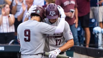 Jun 22, 2024; Omaha, NE, USA; Texas A&M Aggies third baseman Gavin Grahovac (9) and right fielder Jace Laviolette (17) embrace after a home run by Grahovac against the Tennessee Volunteers during the first inning at Charles Schwab Field Omaha. Mandatory Credit: Dylan Widger-USA TODAY Sports