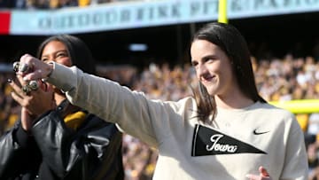 Iowa women’s basketball’s Caitlin Clark shows off her rings during a second quarter timeout during Iowa football’s game against Northwestern Saturday, Oct. 26, 2024 at Kinnick Stadium in Iowa City, Iowa.