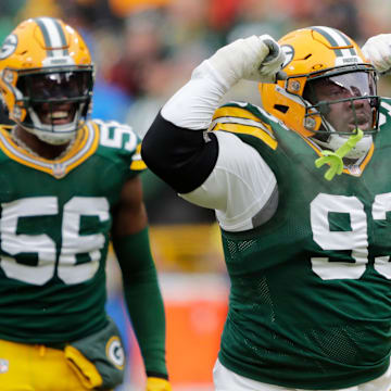 Green Bay Packers defensive tackle T.J. Slaton (93) celebrates making a tackle against the Bears.