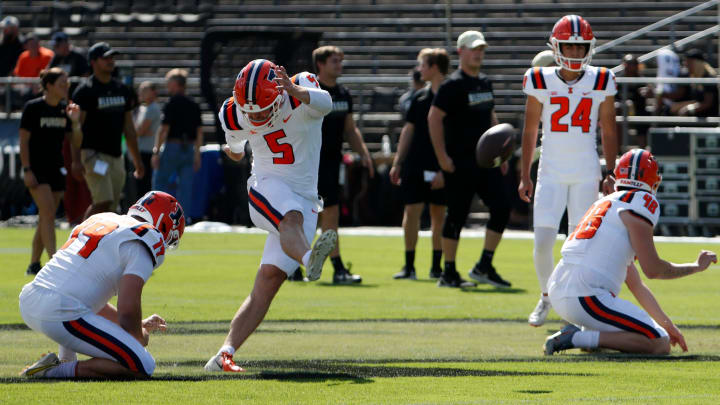 Illinois Fighting Illini punter Hugh Robertson (19) and Illinois Fighting Illini place kicker Caleb Griffin (5) practice kicking ahead of the NCAA football game against the Purdue Boilermakers, Saturday, Sept. 30, 2023, at Ross-Ade Stadium in West Lafayette, Ind.