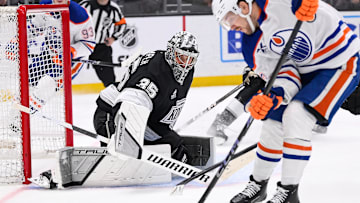 Apr 5, 2025; Los Angeles, California, USA; Edmonton Oilers left wing Viktor Arvidsson (33) moves the puck to take a shot as Los Angeles Kings goaltender Darcy Kuemper (35) defends the goal during the first period at Crypto.com Arena. Mandatory Credit: Robert Hanashiro-Imagn Images