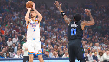 May 18, 2024; Dallas, Texas, USA; Oklahoma City Thunder forward Chet Holmgren (7) shoots as Dallas Mavericks guard Kyrie Irving (11) defends during the first quarter in game six of the second round of the 2024 NBA playoffs at American Airlines Center. Mandatory Credit: Kevin Jairaj-Imagn Images