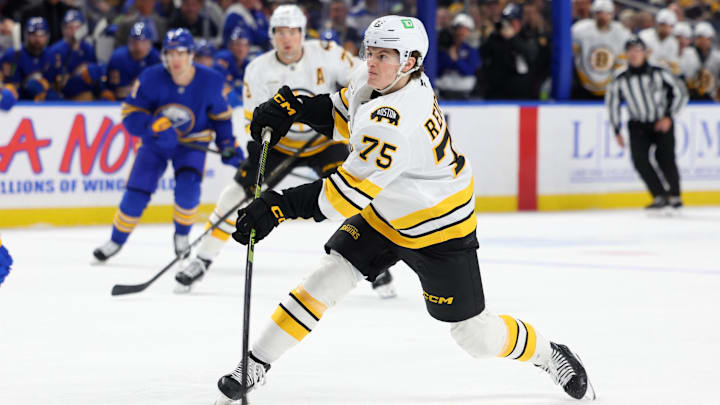 Mar 25, 2026; Buffalo, New York, USA;  Boston Bruins left wing Lukas Reichel (75) takes a shot on goal during the first period against the Buffalo Sabres at KeyBank Center. Mandatory Credit: Timothy T. Ludwig-Imagn Images