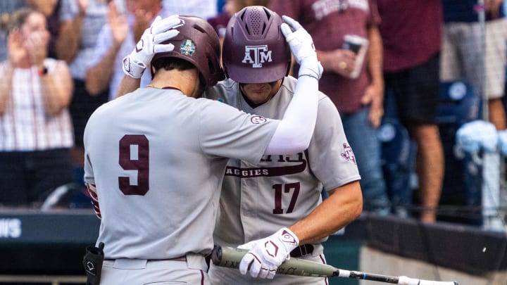 Jun 22, 2024; Omaha, NE, USA; Texas A&M Aggies third baseman Gavin Grahovac (9) and right fielder Jace Laviolette (17) embrace after a home run by Grahovac against the Tennessee Volunteers during the first inning at Charles Schwab Field Omaha. 