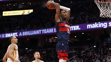 Nov 25, 2025; Washington, District of Columbia, USA; Washington Wizards center Alex Sarr (20) dunks the ball as Atlanta Hawks forward Zaccharie Risacher (10) looks on in the second half at Capital One Arena. Mandatory Credit: Geoff Burke-Imagn Images
