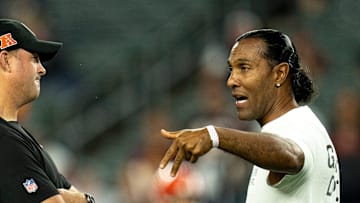 T.J. Houshmandzadeh, forner Bengal, speaks to Cincinnati Bengals head coach Zac Taylor before the NFL game at Paycor Stadium in Cincinnati on Monday, Sept. 23, 2024.