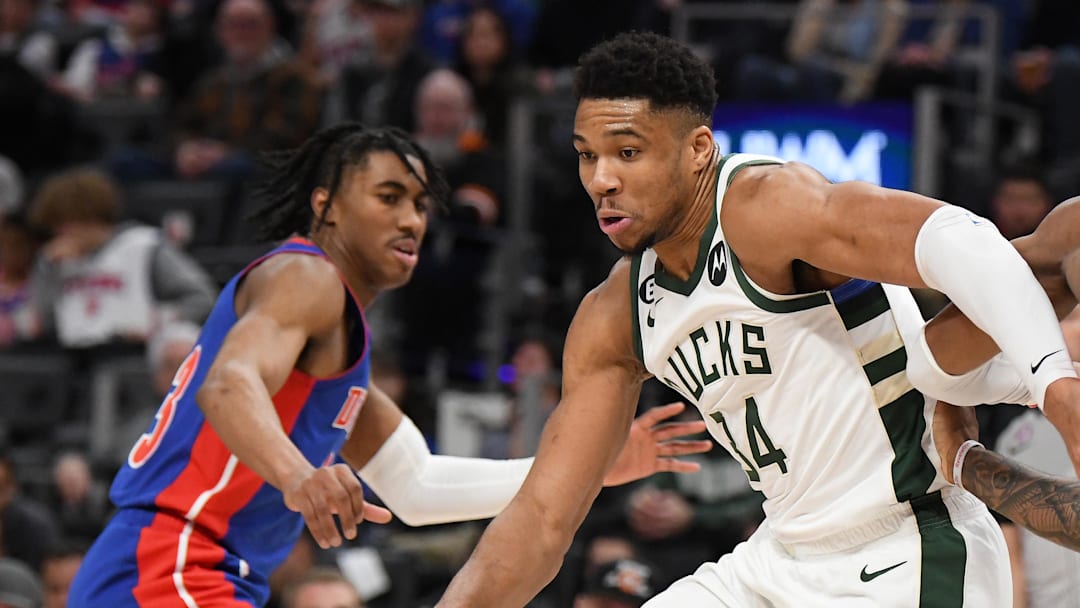 Jan 23, 2023; Detroit, Michigan, USA;  Milwaukee Bucks forward Giannis Antetokounmpo (34) drives between Detroit Pistons guard Jaden Ivy (23) (left) and forward Sadie Bey (41) in the third quarter at Little Caesars Arena. Mandatory Credit: Lon Horwedel-Imagn Images