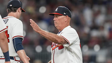 Jun 20, 2022; Cumberland, Georgia, USA; Atlanta Braves manager Brian Snitker (43) takes the ball from starting pitcher Max Fried (54) as he removes him from the game against the San Francisco Giants during the eighth inning at Truist Park. Mandatory Credit: Dale Zanine-Imagn Images