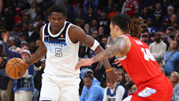 Jan 20, 2025; Memphis, Tennessee, USA; Minnesota Timberwolves guard Anthony Edwards (5) dribbles as Memphis Grizzlies forward Brandon Clarke (15) defends during the fourth quarter at FedExForum. Mandatory Credit: Petre Thomas-Imagn Images