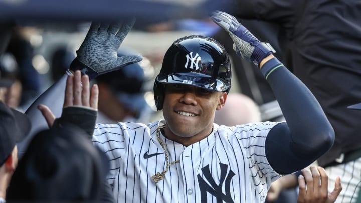 Aug 21, 2024; Bronx, New York, USA;  New York Yankees right fielder Juan Soto (22) celebrates in the dugout after hitting a two run home run in the first inning against the Cleveland Guardians at Yankee Stadium.