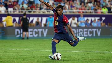 Jul 30, 2024; Orlando, FL, USA; Barcelona defender Alejandro Balde (3) makes a penalty kick against Manchester City in a tie breaker during a Champions Tour friendly match at Camping World Stadium. Mandatory Credit: Nathan Ray Seebeck-Imagn Images