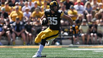 Aug 31, 2024; Iowa City, Iowa, USA; Iowa Hawkeyes tight end Luke Lachey (85) looks for yards after catch against the Illinois State Redbirds during the second quarter at Kinnick Stadium. Mandatory Credit: Jeffrey Becker-Imagn Images