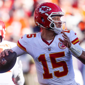 Nov 16, 2025; Denver, Colorado, USA;  Kansas City Chiefs quarterback Patrick Mahomes (15) throws a pass during the first quarter of the game against the Denver Broncos at Empower Field at Mile High. Mandatory Credit: Ron Chenoy-Imagn Images