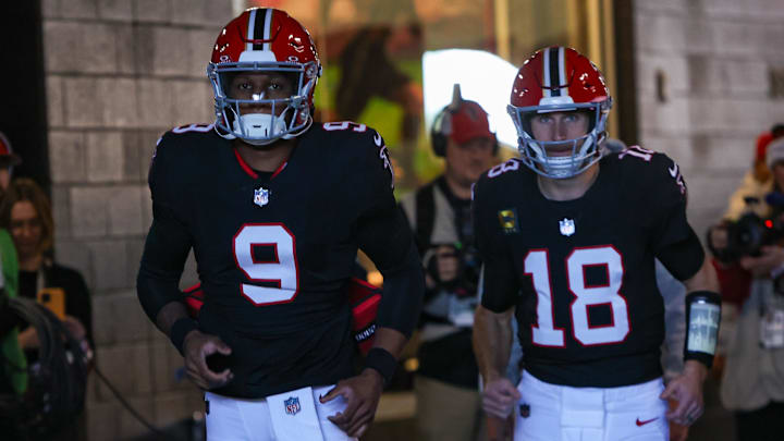 Dec 22, 2024; Atlanta, Georgia, USA; Atlanta Falcons quarterback Michael Penix Jr. (9) and quarterback Kirk Cousins (18) run on the field before a game against the New York Giants at Mercedes-Benz Stadium. Mandatory Credit: Brett Davis-Imagn Images