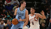 Feb 25, 2025; Memphis, Tennessee, USA; Memphis Grizzlies guard Luke Kennard (10) handles the ball as Phoenix Suns guard Grayson Allen (8) defends during the fourth quarter at FedExForum. Mandatory Credit: Petre Thomas-Imagn Images