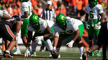 Snap decision: Center Iapani "Poncho" Laloulu makes the line calls and identifies the blitzes for the Ducks. His leadership is critical for a rebuilt offensive line to continue performing at a high level in 2025.