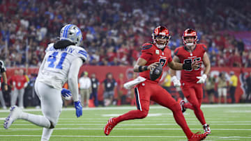 Nov 10, 2024; Houston, Texas, USA; Houston Texans quarterback C.J. Stroud (7) scrambles with the ball as Detroit Lions linebacker James Houston (41) defends during the first quarter at NRG Stadium. Mandatory Credit: Troy Taormina-Imagn Images