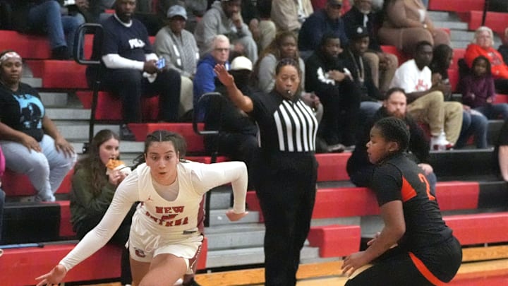 New Smyrna Beach's Olivia Olson (3) drives toward the basket against Leesburg, Friday, Feb. 21, 2025 during the Region 2-5A finals in New Smyrna Beach.