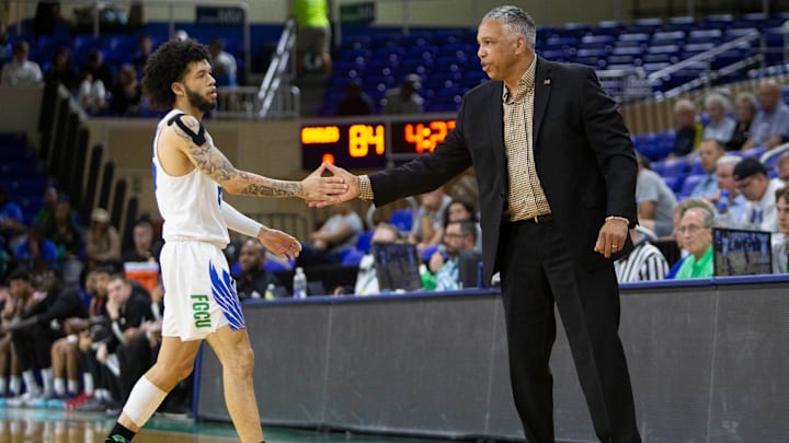 Florida Gulf Coast Eagles guard Tavian Dunn-Martin (5) and Florida Gulf Coast Eagles assistant coach Kevin Sutton shakes hands during the second half of The Basketball Classic presented by Eracism first-round matchup between the Detroit Mercy Titans and the Florida Gulf Coast Eagles, Wednesday, March 16, 2022, at Alico Arena in Fort Myers, Fla.Florida Gulf Coast Eagles defeated the Detroit Mercy Titans 95-79.

The Basketball Classic 2022: Detroit Mercy Titans at Florida Gulf Coast Eagles, first