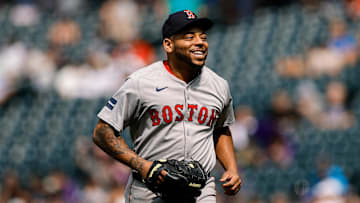 Jul 24, 2024; Denver, Colorado, USA; Boston Red Sox first baseman Dominic Smith (2) reacts after pitching in the eighth inning against the Colorado Rockies at Coors Field. Mandatory Credit: Isaiah J. Downing-Imagn Images