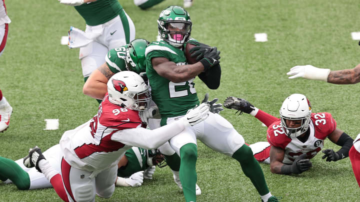Oct 11, 2020; East Rutherford, New Jersey, USA; New York Jets running back Le'Veon Bell (26) is tackled by Arizona Cardinals defensive end Angelo Blackson (96) during the second half at MetLife Stadium. Mandatory Credit: Vincent Carchietta-USA TODAY Sports
