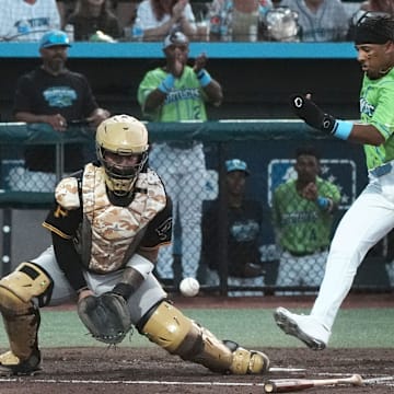 Daytona's Carlos Sanchez (33) scores a run as Bradenton's catcher waits for the throw, Friday, April 4, 2025 at Jackie Robinson Ballpark in Daytona Beach.