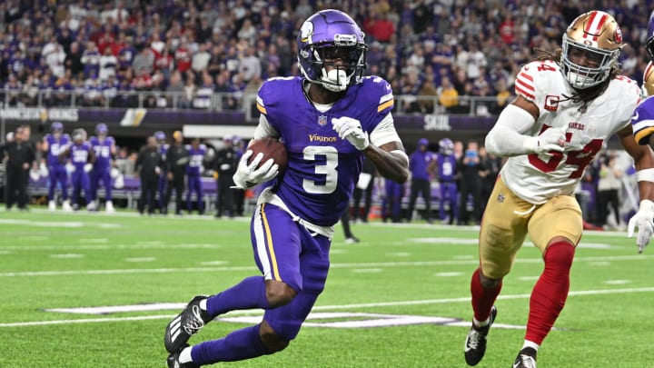 Oct 23, 2023; Minneapolis, Minnesota, USA; Minnesota Vikings wide receiver Jordan Addison (3) runs with the ball as San Francisco 49ers linebacker Fred Warner (54) pursues during the game at U.S. Bank Stadium.