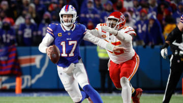 Buffalo Bills quarterback Josh Allen (17) is caught from behind by Kansas City Chiefs defensive tackle Chris Jones (95).