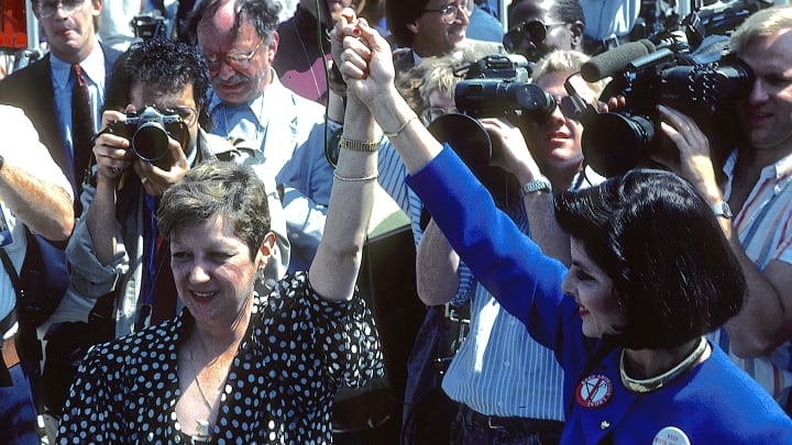 Norma McCorvey and lawyer Gloria Allred attend a rally outside the U.S. Supreme Court Building in 1989.