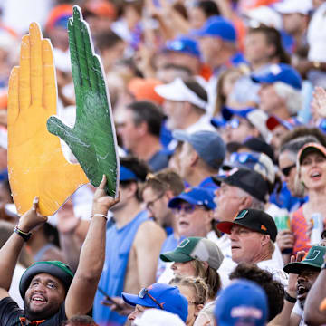 Aug 31, 2024; Gainesville, Florida, USA; A Miami Hurricanes fan holds a sign against the Florida Gators during the second half at Ben Hill Griffin Stadium. Mandatory Credit: Matt Pendleton-Imagn Images