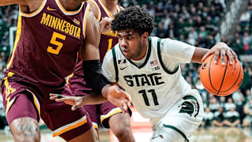 Michigan State guard Jase Richardson (11) dribbles against Minnesota guard Femi Odukale (11) during the second half at Breslin Center in East Lansing on Tuesday, Jan. 28, 2025.