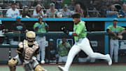 Daytona's Carlos Sanchez (33) scores a run as Bradenton's catcher waits for the throw, Friday, April 4, 2025 at Jackie Robinson Ballpark in Daytona Beach.