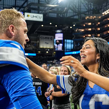 Detroit Lions quarterback Jared Goff (16) hugs his wife Christen Harper 