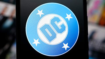 In this photo illustration, the DC Comics logo is seen...