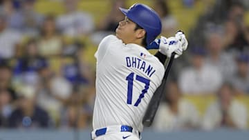 Sep 6, 2024; Los Angeles, California, USA;  Los Angeles Dodgers designated hitter Shohei Ohtani (17) hits a long fly ball for an out in the first inning against the Cleveland Guardians at Dodger Stadium. Mandatory Credit: Jayne Kamin-Oncea-Imagn Images