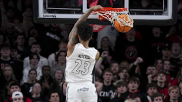 Jan 18, 2025; Cincinnati, Ohio, USA;  Cincinnati Bearcats forward Dillon Mitchell (23) dunks the ball against the Arizona State Sun Devils in the second half at Fifth Third Arena. Mandatory Credit: Aaron Doster-Imagn Images