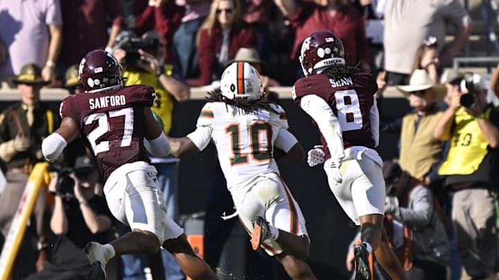 Dec 20, 2025; College Station, TX, USA; Miami Hurricanes wide receiver Malachi Toney (10) runs for the game-winning touchdown against Texas A&M Aggies linebacker Daymion Sanford (27) and cornerback Jordan Shaw (8) during the second half of the first round game of the CFP National Playoff at Kyle Field. Mandatory Credit: Jerome Miron-Imagn Images