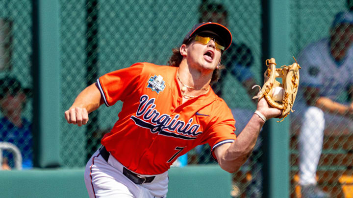 Virginia Cavaliers left fielder Aidan Teel (7) gets an out during the eighth inning against the North Carolina Tar Heels at Charles Schwab Filed Omaha. Virginia Cavaliers left fielder Aidan Teel (7) gets an out during the eighth inning against the North Carolina Tar Heels at Charles Schwab Filed Omaha.