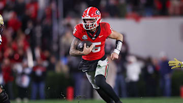 Nov 29, 2024; Athens, Georgia, USA; Georgia Bulldogs quarterback Carson Beck (15) runs the ball against the Georgia Tech Yellow Jackets in the fourth quarter at Sanford Stadium. Mandatory Credit: Brett Davis-Imagn Images
