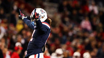 Nov 15, 2024; Tucson, Arizona, USA; Arizona Wildcats defensive back Genesis Smith (12) celebrates a blocked catch during the third quarter against the Houston Cougars at Arizona Stadium. Mandatory Credit: Aryanna Frank-Imagn Images