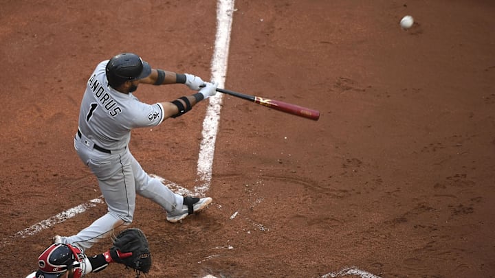 Chicago White Sox shortstop Elvis Andrus (1) hits an RBI double during the fifth inning against the Boston Red Sox at Fenway Park in 2023.