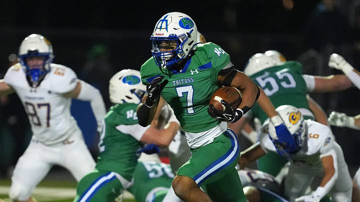 Green Bay Notre Dame's Kingston Allen (7) runs the ball during a WIAA Division 2 first-round playoff game against Germantown High School on Oct. 23, 2026, in Green Bay, Wis. Green Bay Notre Dame defeated Germantown 63-9.