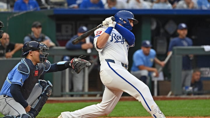 Jul 3, 2024; Kansas City, Missouri, USA; Kansas City Royals first base Vinnie Pasquantino (9) hits an RBI single in the third inning against the Tampa Bay Rays at Kauffman Stadium. Mandatory Credit: Peter Aiken-USA TODAY Sports