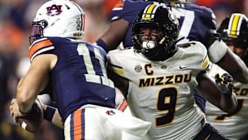 Oct 18, 2025; Auburn, Alabama, USA;  Missouri Tigers defensive end Zion Young (9) moves in to tackle Auburn Tigers quarterback Jackson Arnold (11) during the fourth quarter at Jordan-Hare Stadium.  Mandatory Credit: John Reed-Imagn Images