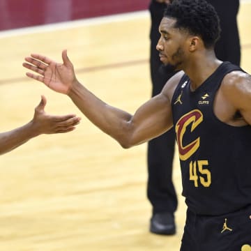 Dec 6, 2022; Cleveland, Ohio, USA; Cleveland Cavaliers guard Darius Garland (10) and guard Donovan Mitchell (45) celebrate in the fourth quarter against the Los Angeles Lakers at Rocket Mortgage FieldHouse. Mandatory Credit: David Richard-USA TODAY Sports