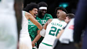 Oct 15, 2025; Boston, Massachusetts, USA; Boston Celtics center Xavier Tillman (26) celebrates with teammates after defeating the Toronto Raptors at TD Garden. Mandatory Credit: Paul Rutherford-Imagn Images